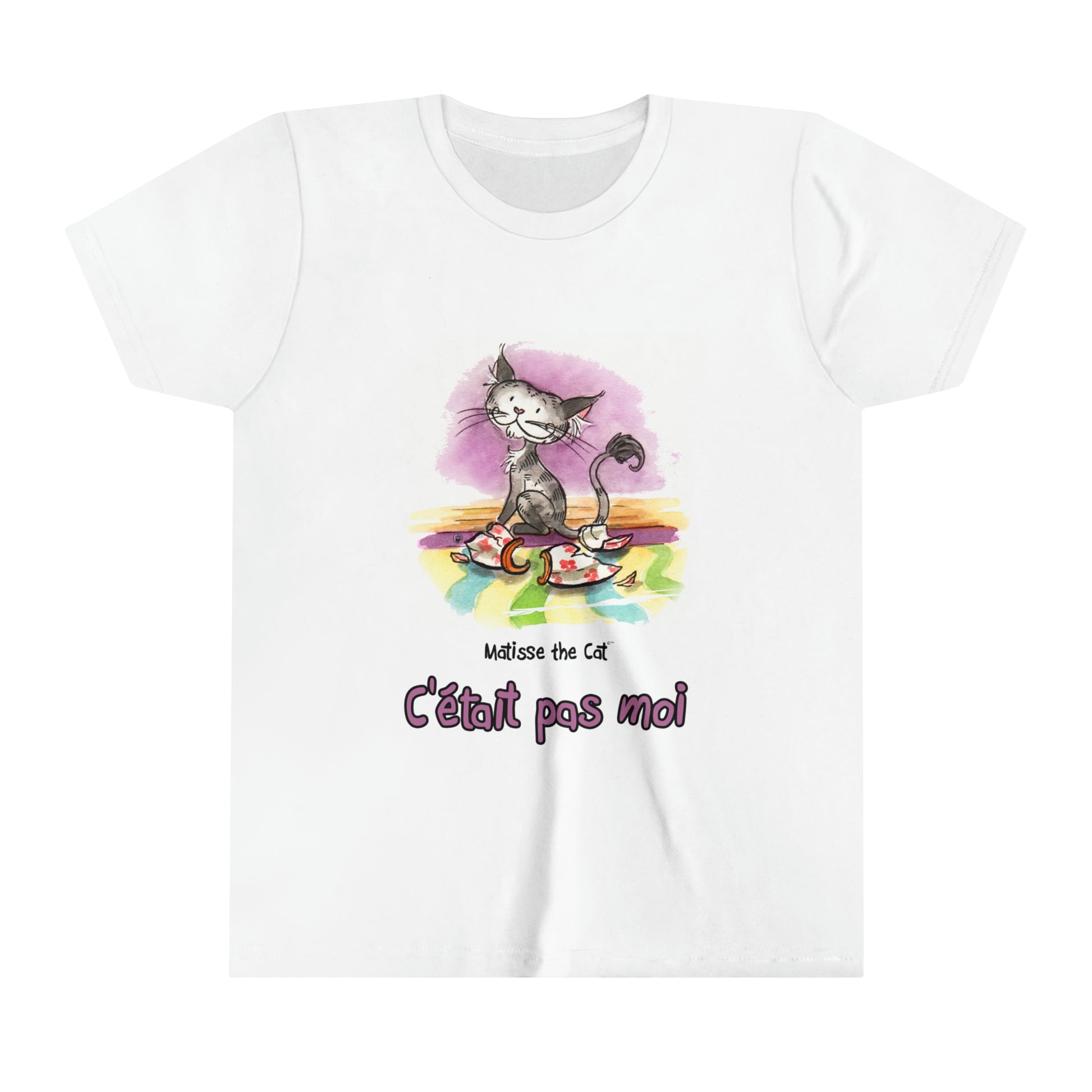 A white official, Matisse the Cat children’s t-shirt with the slogan “c'était pas moi” (It wasn’t me) featuring Matisse sitting on a vibrant carpet, his innocent gaze fixed upon a broken vase.