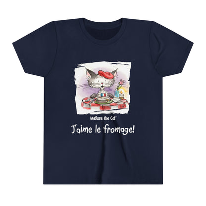 A navy blue official, Matisse the Cat children’s t-shirt with the slogan ‘Jaime le fromage ‘ showcases Matisse sitting at a French bistro table preparing to eat cheese.