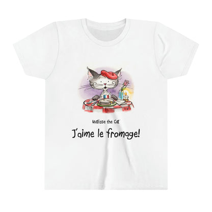 A white official, Matisse the Cat children’s t-shirt with the slogan ‘Jaime le fromage ‘ showcases Matisse sitting at a French bistro table preparing to eat cheese.