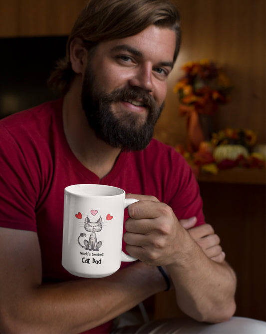 Matisse the cat world’s greatest cat dad 15oz jumbo mug held by a young man.