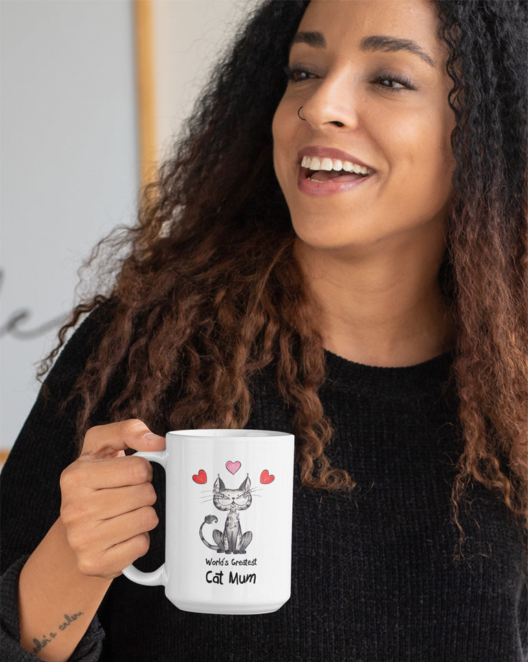 Matisse the cat world’s greatest cat mum 15oz jumbo mug held by a young woman.